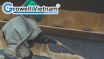 Vì sao cần phun cát tẩy rỉ khung thép trước khi sơn?