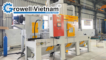 Máy phun cát băng tải lưới là gì? Cấu tạo và ứng dụng